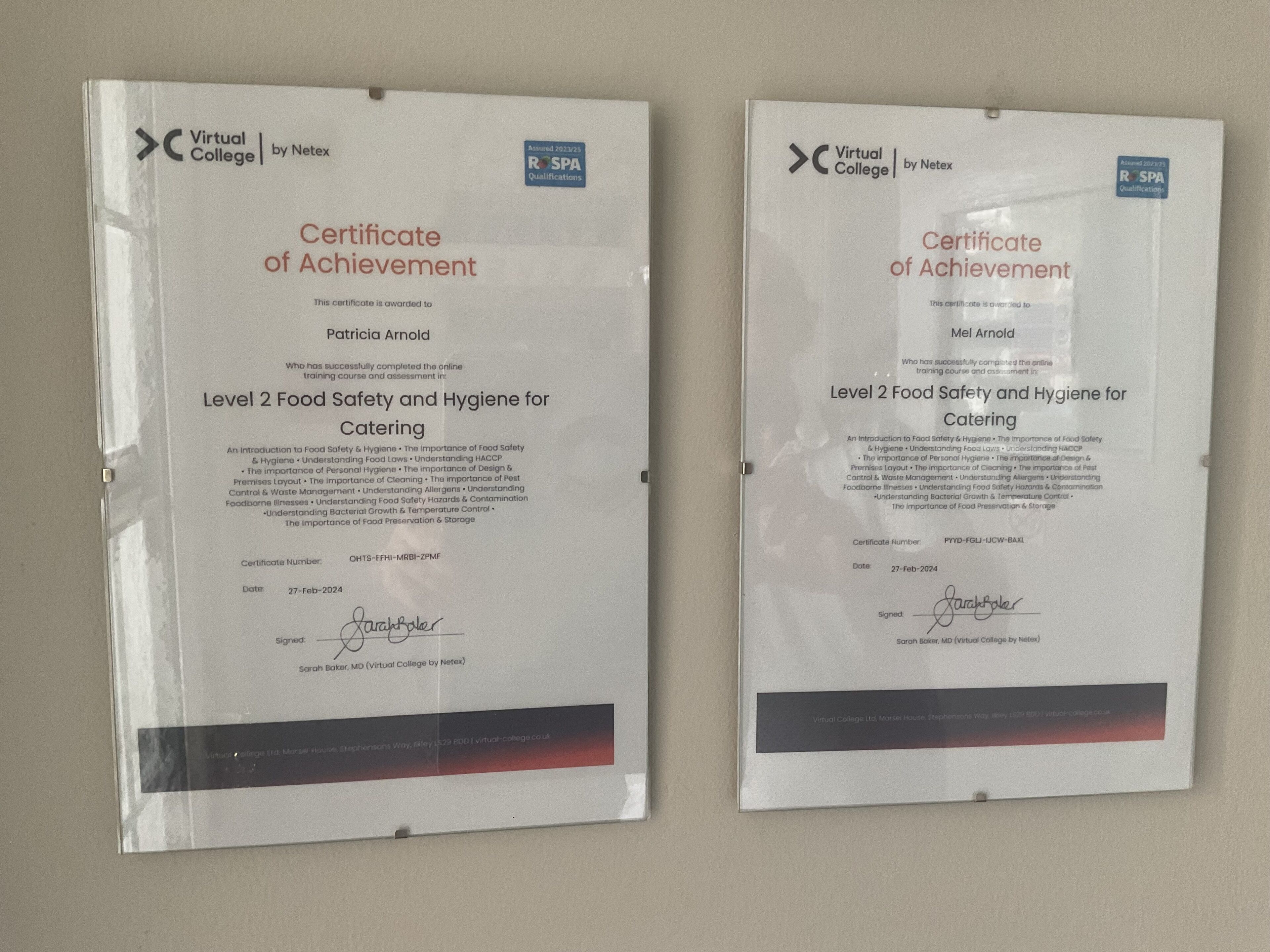 Two certificates of achievement for Level 2 Food Safety and Hygiene for Catering, signed by Sarah Baker, MD, from Virtual College by Netex.