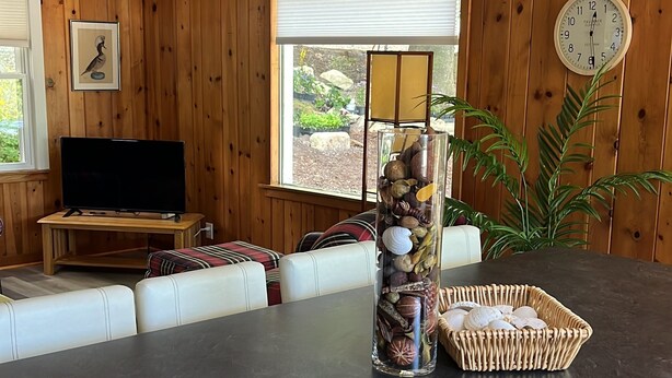 A kitchen with a wooden countertop, a sink, a trash can, and a window with blinds. - Great location 2 minutes Walking to downtown and to the lake (Fish Creek)