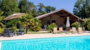 Seasonal outdoor pool, open 11:00 AM to 7:30 PM, pool umbrellas