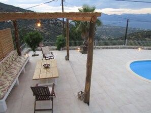 Outdoor dining - Stone house with pool and view to the sea (Αίγιο)