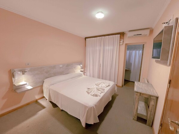Premium bedding, down duvets, in-room safe, desk