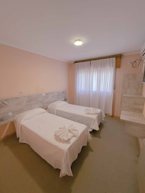Premium bedding, down duvets, in-room safe, desk