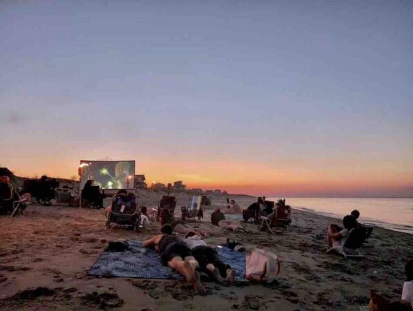 Guests can enjoy outdoor movie nights under the stars on the beach.