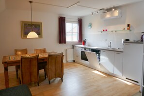 Fridge, stovetop, dishwasher, coffee/tea maker
