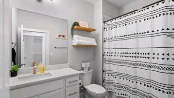 Combined shower/tub, hair dryer, towels, soap
