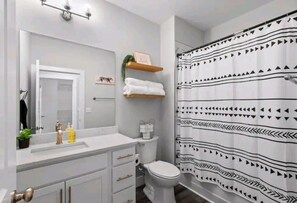 Combined shower/tub, hair dryer, towels, soap