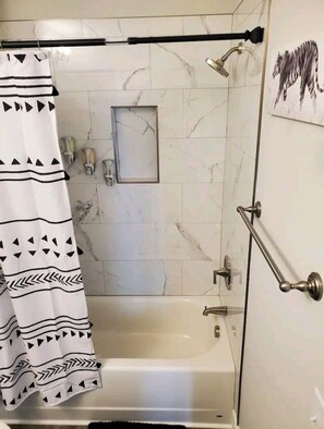 Combined shower/bathtub, hair dryer, towels, soap