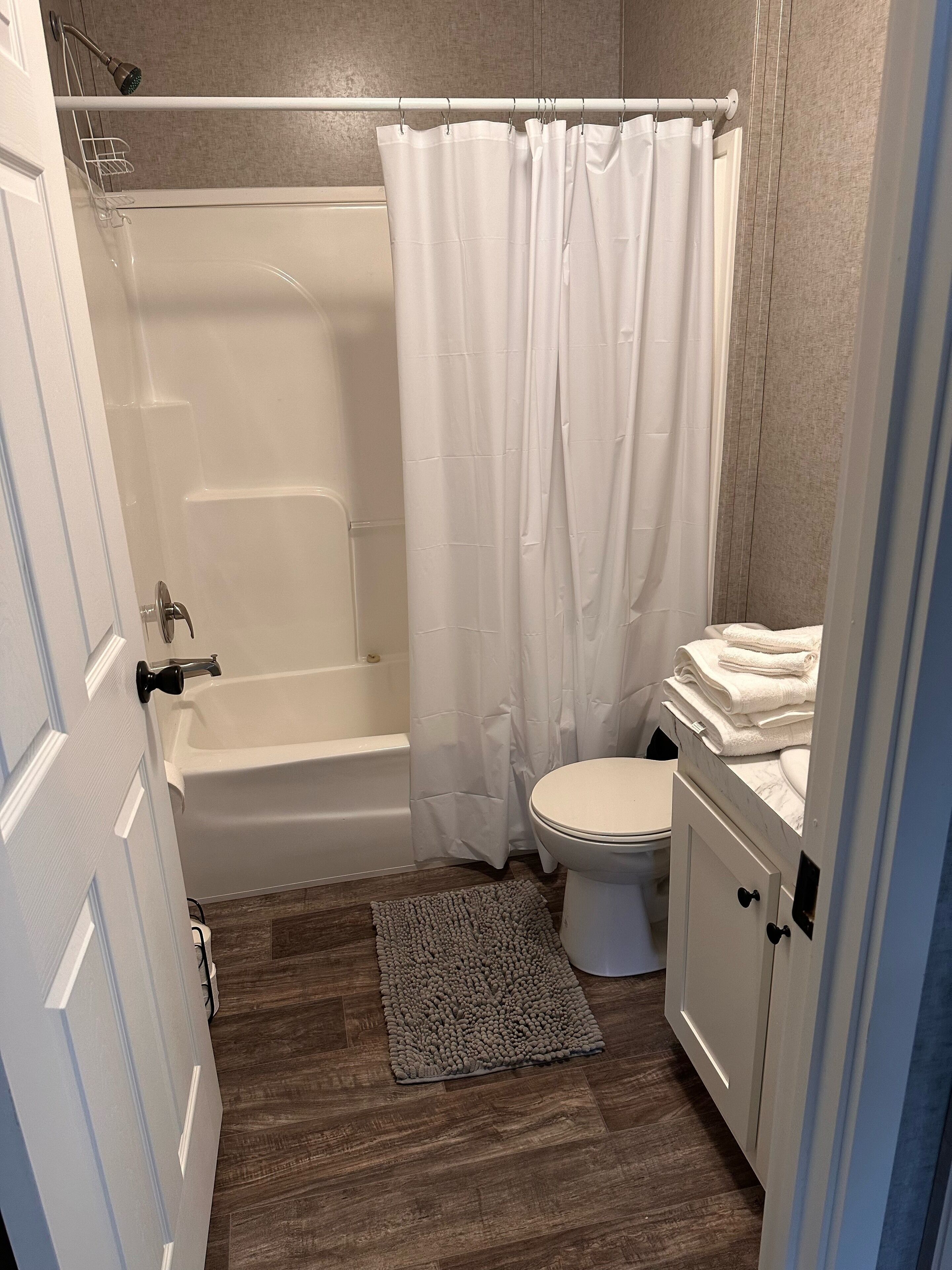 Combined shower/tub, eco-friendly toiletries, towels, soap