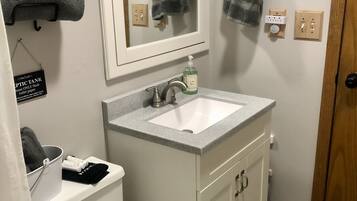 Combined shower/tub, hair dryer, towels, soap