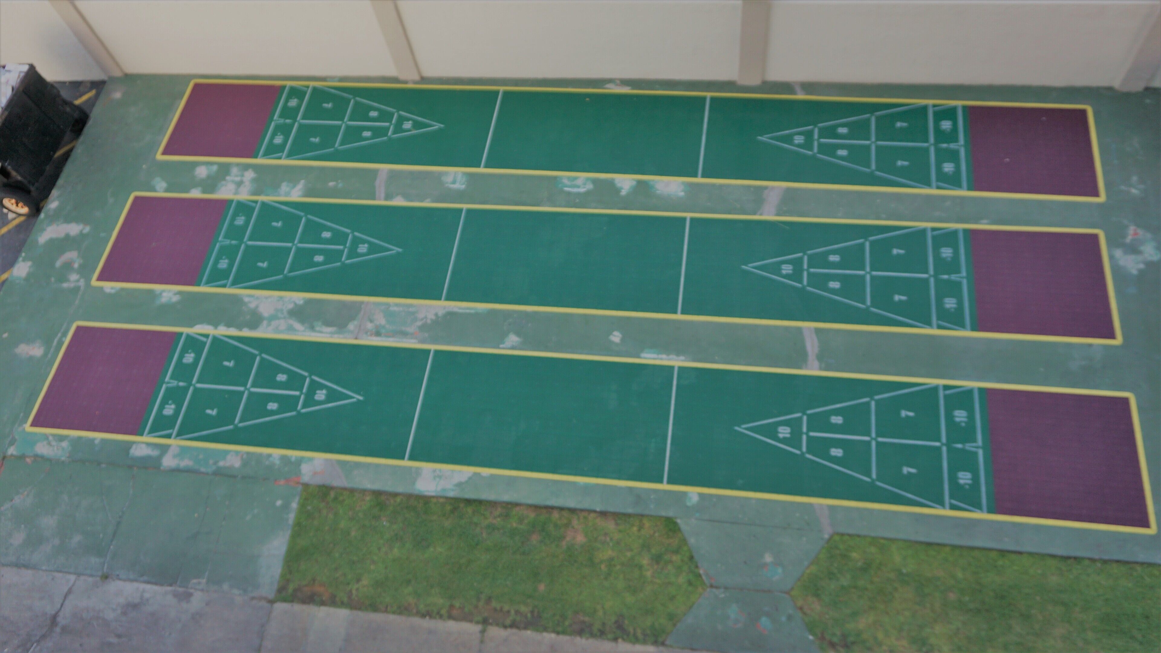 A green and purple floor plan with numbered sections.