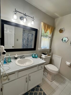 Combined shower/tub, hair dryer, towels, soap