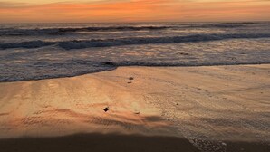 A beach with waves at sunset. - Beach House, 4 Blocks to Ocean/Bay+ BBQ & Firepit! (San Diego)
