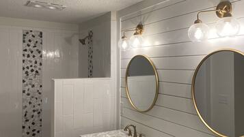 Combined shower/bathtub, hair dryer, towels, soap