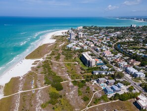 An aerial view of a coastal town with a beach, buildings, and a river. - 1 Bed Cottage, Full Remodel, Beach Access #7, Walk to Village 5 min, 2 AC UNITS! (Siesta Key)