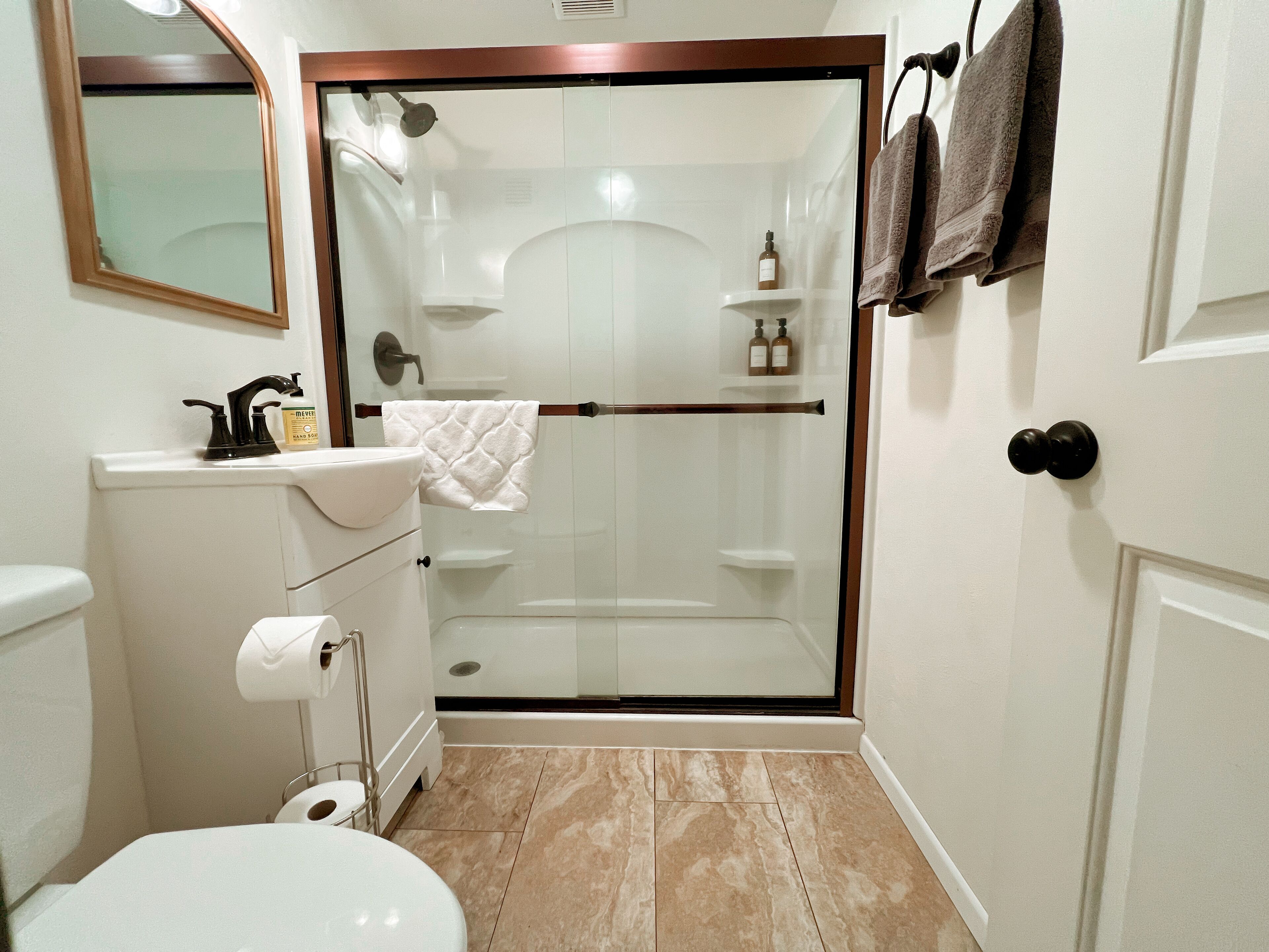 Shower, hair dryer, towels, soap