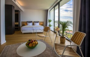 Enjoy a serene view from the large window and relax on the comfortable bed.