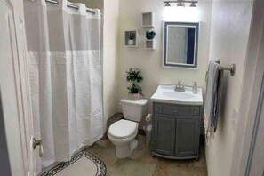 Combined shower/tub, hair dryer, towels, toilet paper