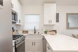 Microwave, dishwasher, cookware/dishes/utensils