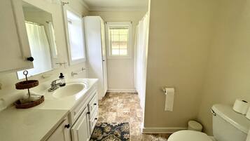 Combined shower/tub, hair dryer, towels, soap