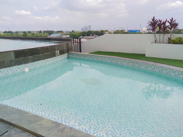 Outdoor pool - Great Location Studio Room At Patraland Urbano Apartment (Bekasi)