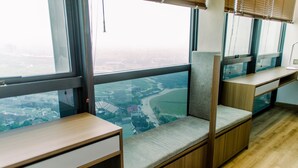 A high-rise office space with a view of a cityscape. - Elegant And Nice 1Br At The Smith Alam Sutera Apartment (Tangerang)