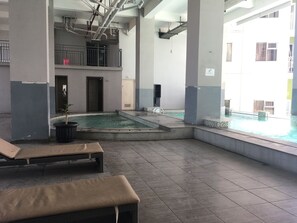 Outdoor pool - Well Appointed 1BR Apartment at Harvard Jatinangor (Cileunyi)