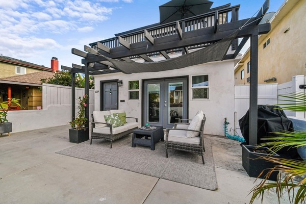 Relax on you private patio after a long day at the beach and cruising the provided beach cruisers on the boardwalk that's one block away.