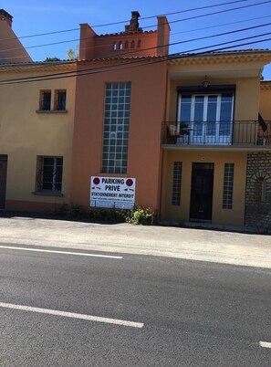 parking available, with restricted access. The building features a unique blend of architectural styles.