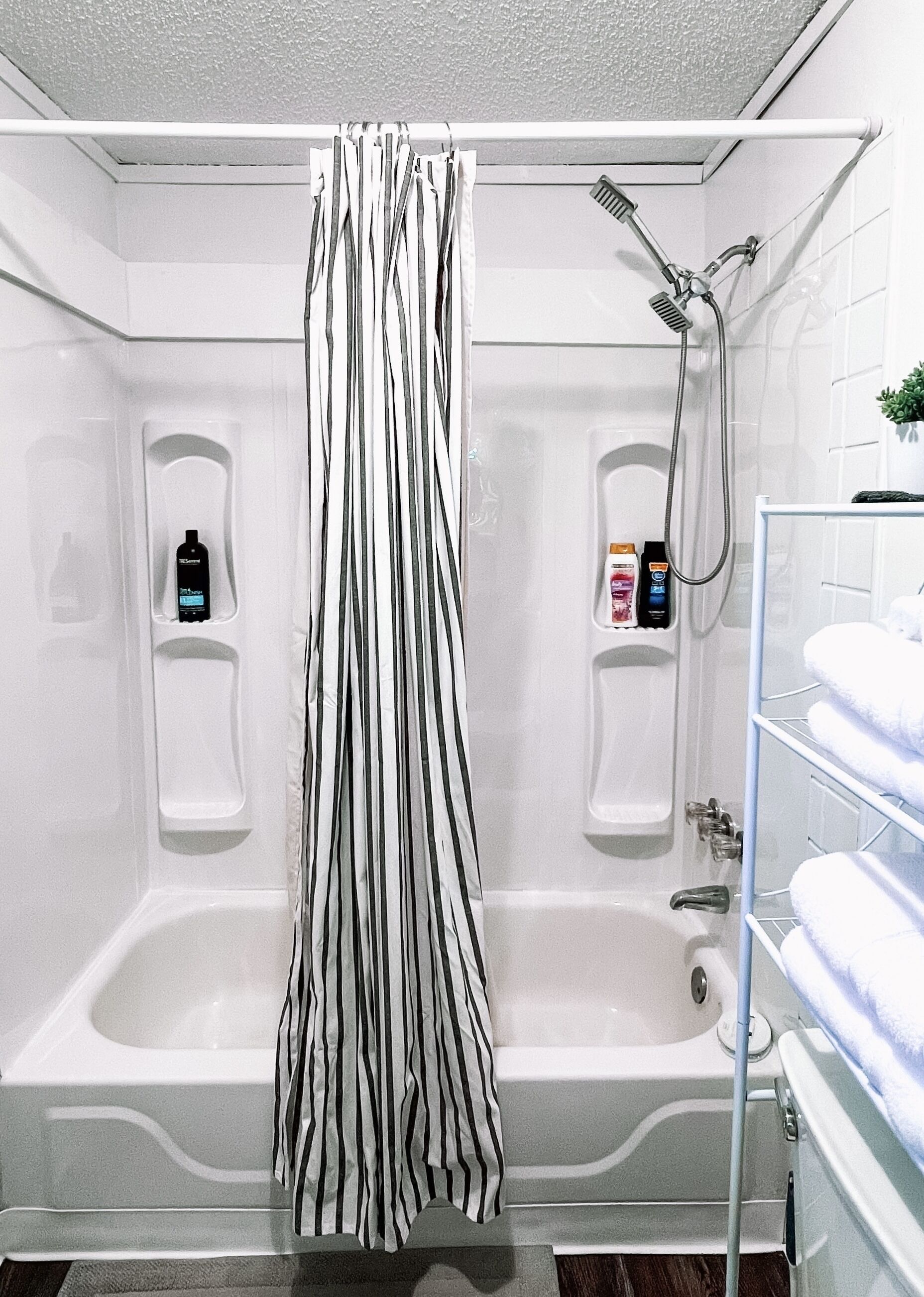Combined shower/tub, hair dryer, towels, soap