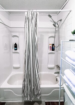 Combined shower/tub, hair dryer, towels, soap