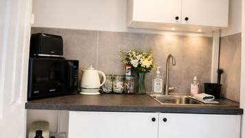 Fridge, microwave, electric kettle, toaster