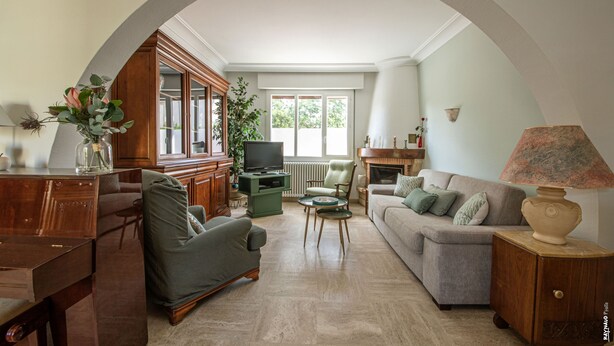 A living room with a television, sofa, armchair, and a coffee table. - Pleasant house with garden - Near downtown (Albi)
