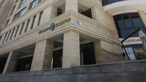 A multi-story building with a prominent 'ROOFTOP' sign, large windows, and a modern architectural style. - Rooftop Apart Hotel (Yerevan)