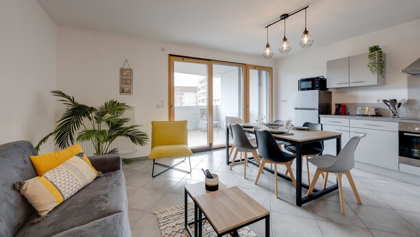 A modern apartment with a living room, dining area, and kitchen. - L'Art de Ville*** - 2  bedroom near the city center, terrace and garage (Annecy)