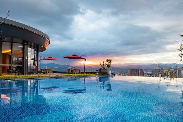2 indoor pools, outdoor pool, open 7:00 AM to 10:00 PM, pool umbrellas