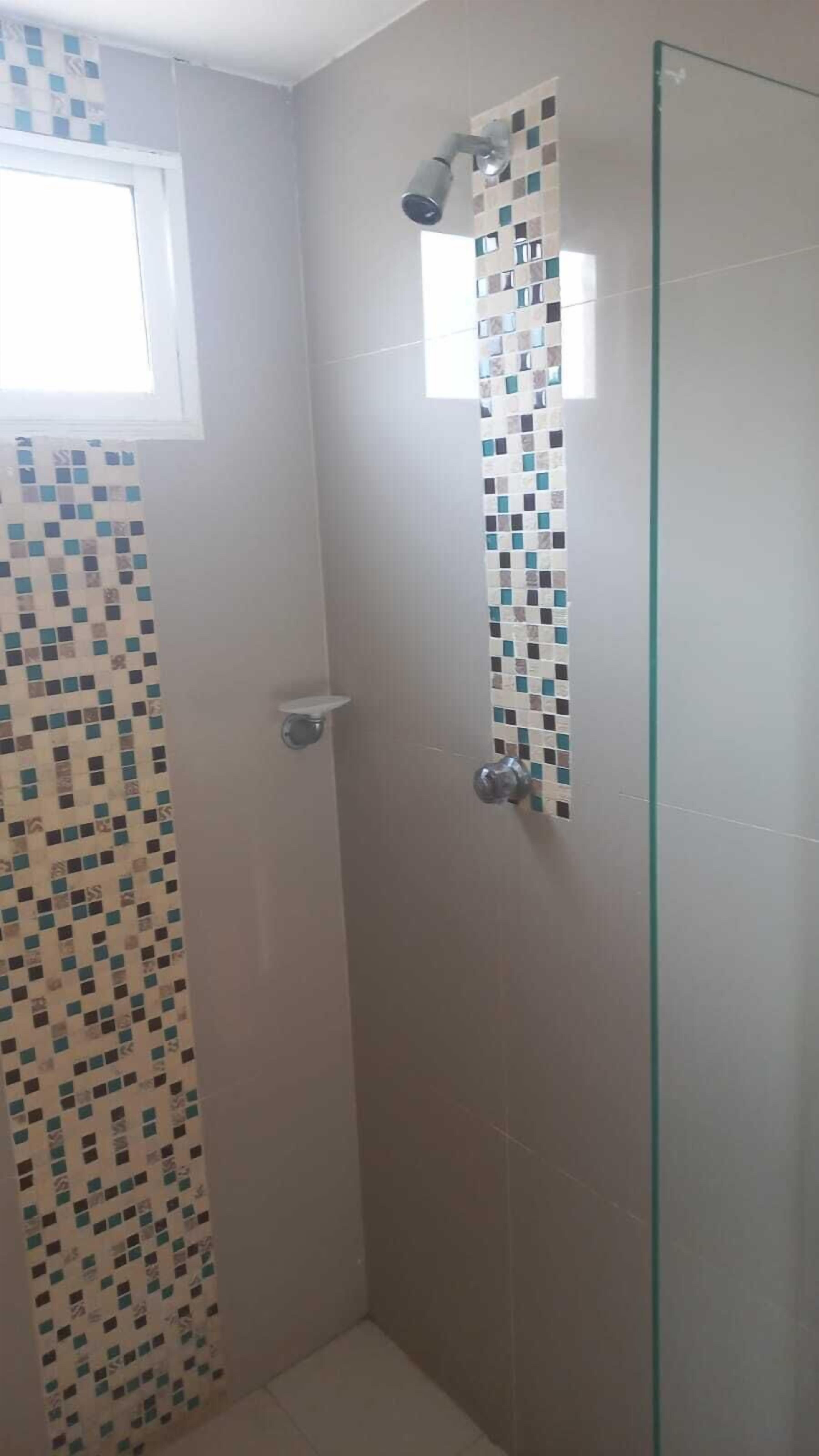 Shower, rainfall showerhead, hair dryer, towels