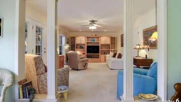 Smart TV, fireplace, books, stereo