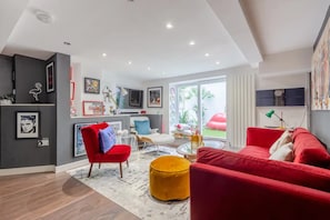 Basic Apartment, Multiple Beds | Living room | TV - Swanky Apartment in Bethnal Green With Garden (London)
