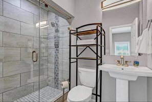 Bathtub, hair dryer, towels, soap