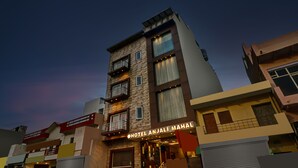 A multi-story hotel with balconies and a sign reading "HOTEL ANJALI MAHAL". - Itsy Hotels Anjali Mahal 500, Mtrs From Mathura Railway Station (Mathura)