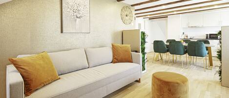 Una sala moderna con sofá, reposapiés y comedor con sillas.
