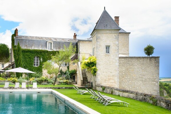 A heated pool, pool loungers