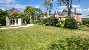 A large, historic building with multiple towers and a well-maintained lawn in front. - The Secret Hamlet - Eleven Bedroom Castle, Sleeps 24 (Ingrandes)