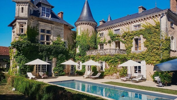 A large, historic building with a swimming pool, outdoor seating, and ivy-covered walls. - The Secret Hamlet - Eleven Bedroom Castle, Sleeps 24 (Ingrandes)