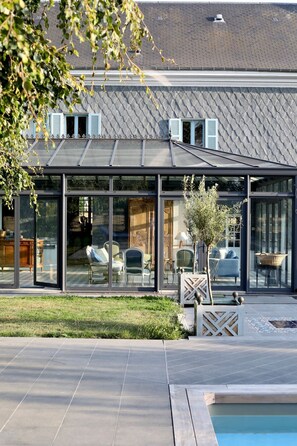 A heated pool, pool loungers