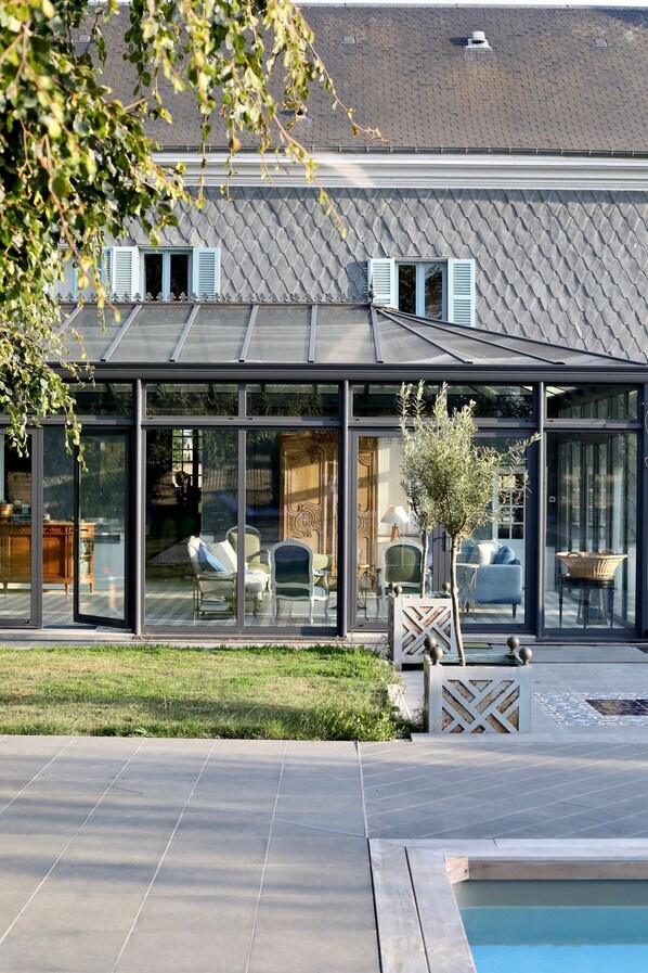 A heated pool, pool loungers