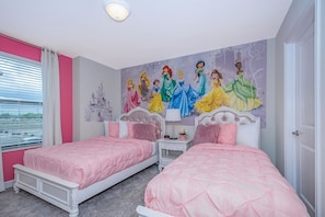 A bedroom with two beds, a mural of Disney princesses, and a castle illustration on the wall. - Luxury Villa Storey Lake, 15min→Disney, private pool + hot tub + No Extra Fees (Kissimmee)