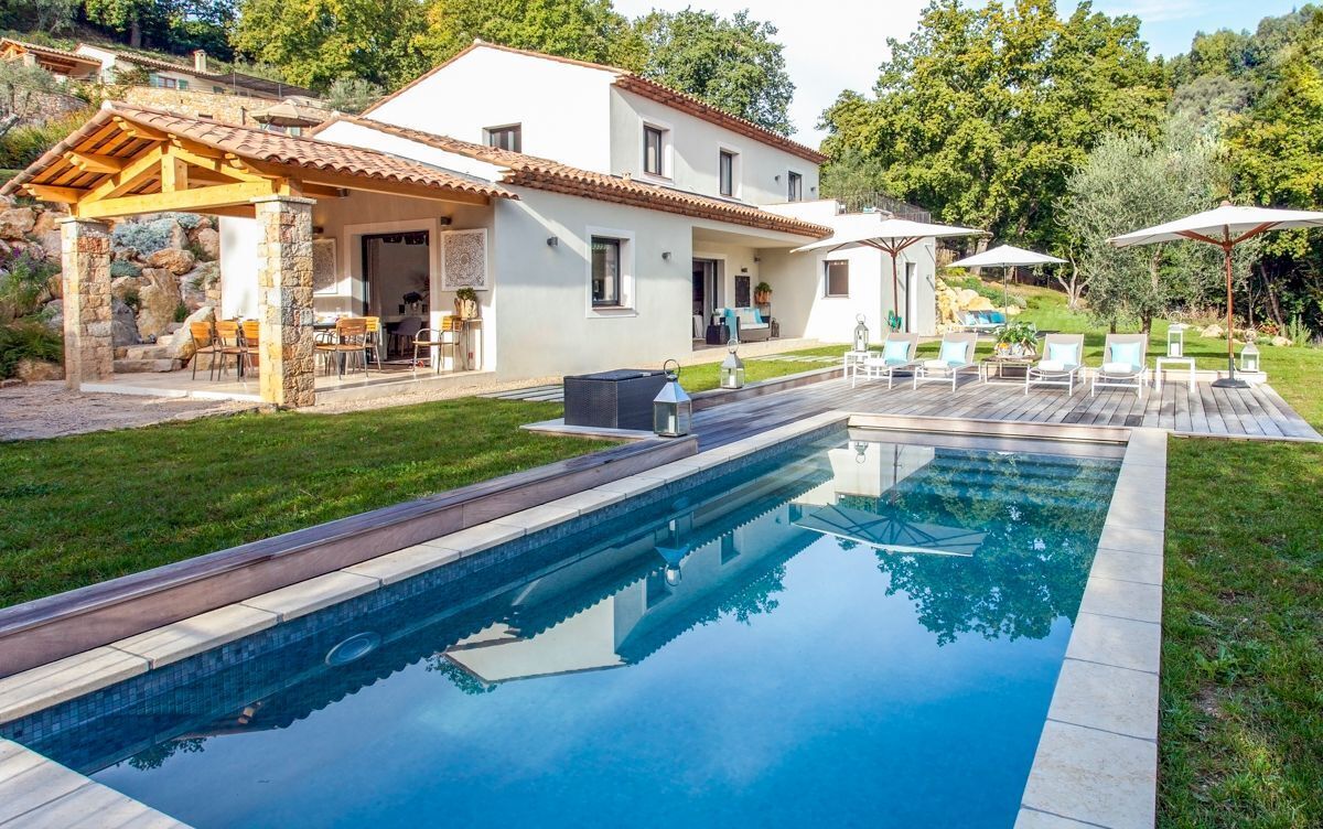 A heated pool, sun loungers