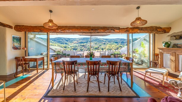 A dining area with a large table, chairs, and a view of the countryside. - Le Jardin Secret - Four Bedroom Villa, Sleeps 8 (Laurac)