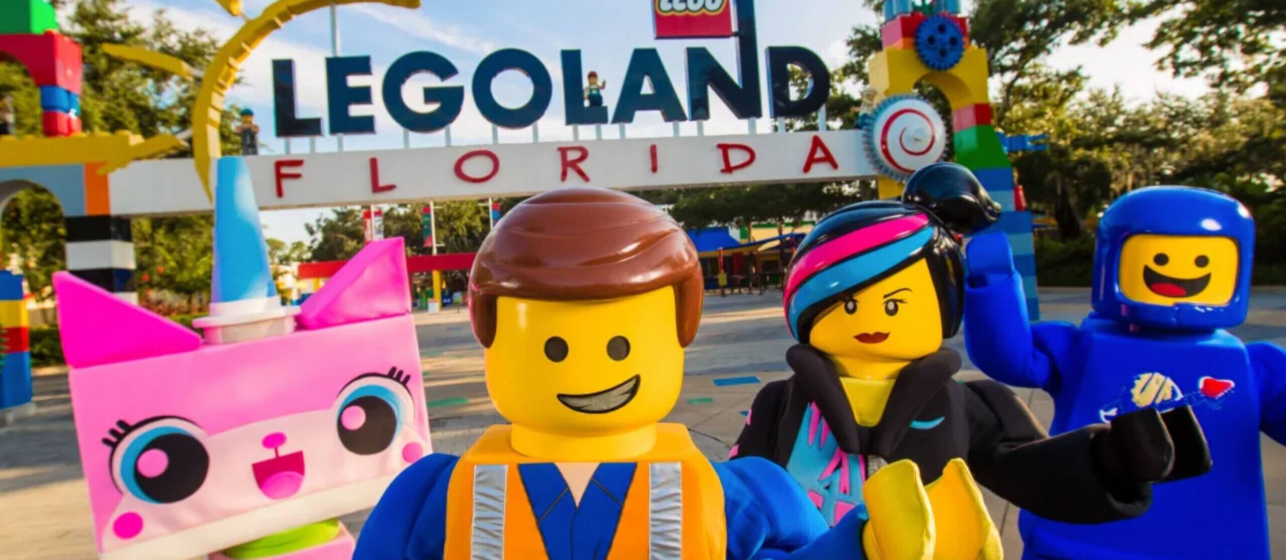 LEGO characters in front of a sign that reads "LEGOLAND Florida".